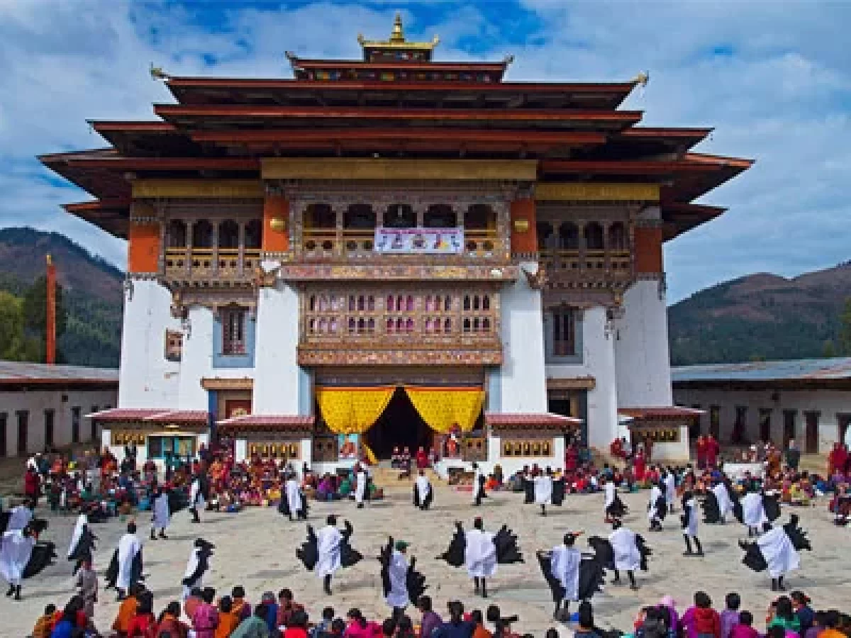 Masked dancers performing at Bhutan's Black Necked Crane Festival in Gangtey