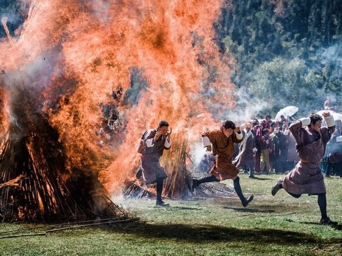Sacred fire blessing ritual at Thangbi Mani Festival Tour in Bumthang valley, Bhutan