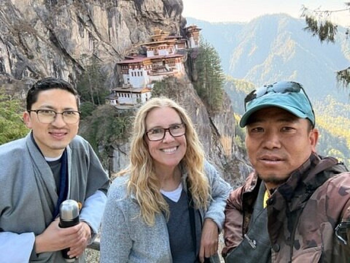 Lisa with guide Karma and driver Gyem at Tiger's Nest on a Bhutan birding and cultural tour